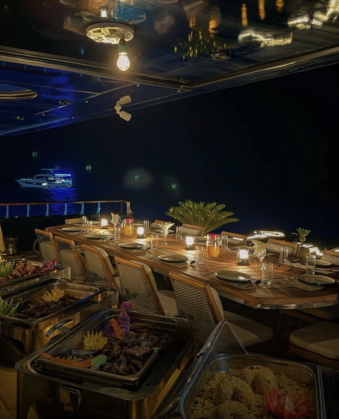 Jasmine outdoor dining deck set for dinner at night